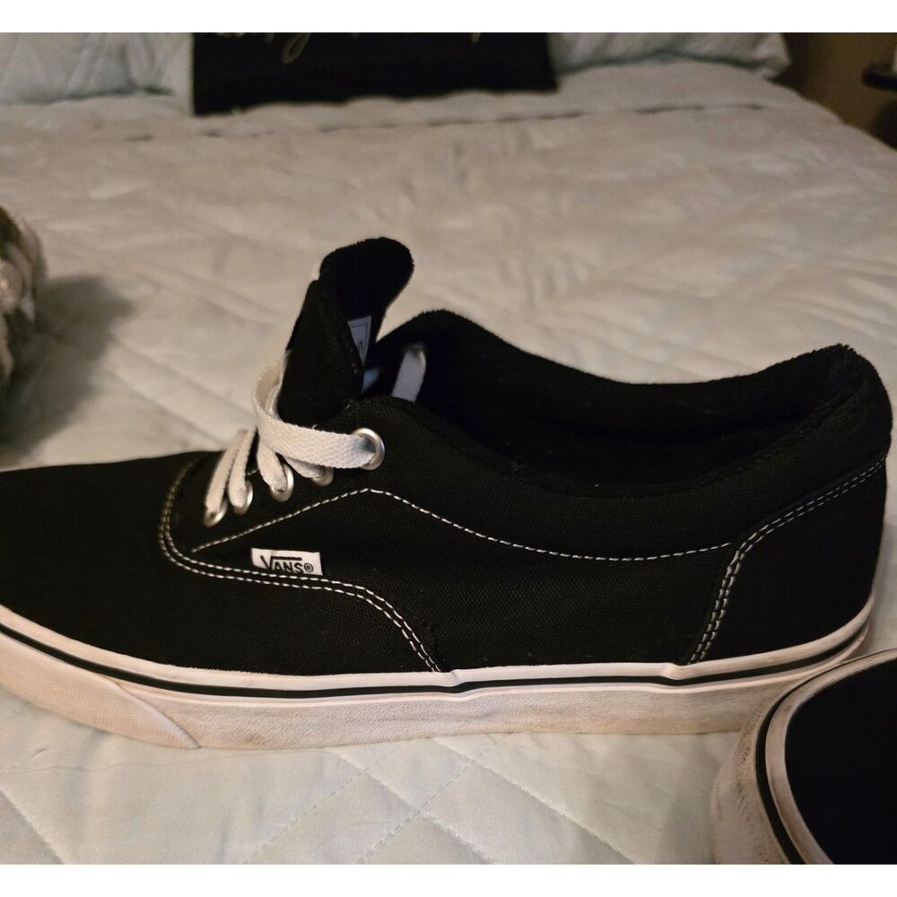 These are black Vans Authentic sneakers with white laces. - Picture 8 of 9